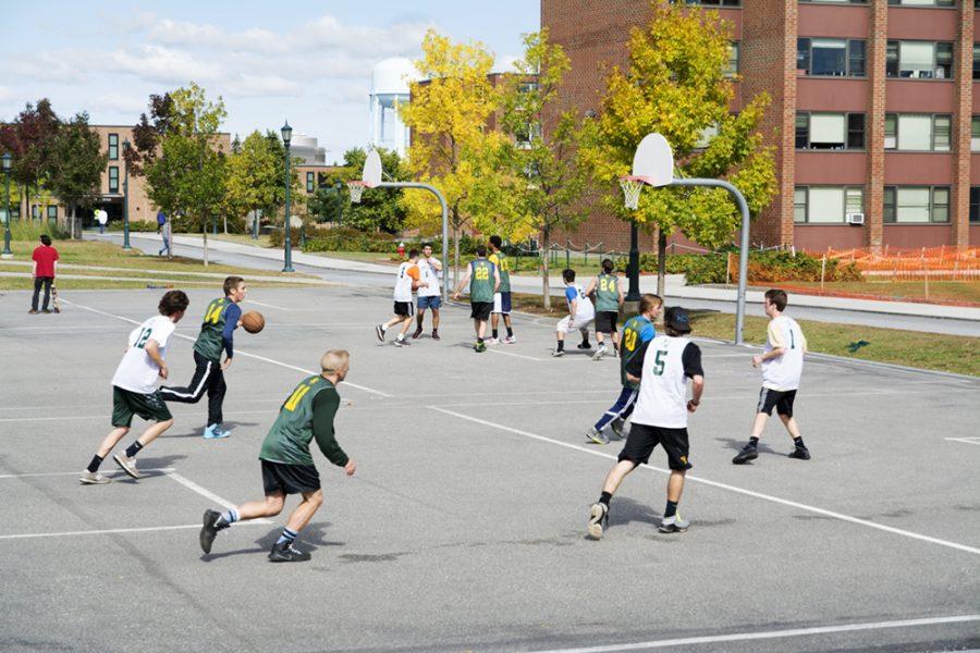 Students play pickup basketball outside of Harris Millis residential hall Oct. 2. UVM researchers are researching methods of decreasing suicide rates, including increased exercise.  KAT WAKS/ The Veromont Cynic 
