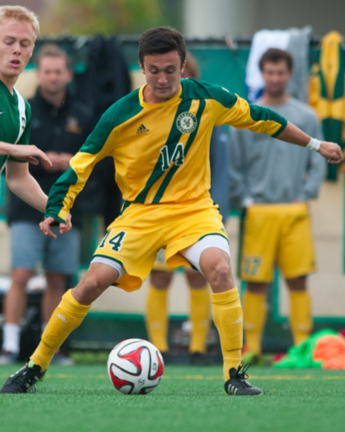 Senior Gideon Rosenthal battles for the ball during a game against Dartmouth College Oct. 1, 2014. (Photo: Brian Jenkin)