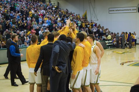 Mens basketball players gather together