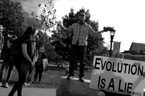 Three preachers draw crowd, ire outside library
