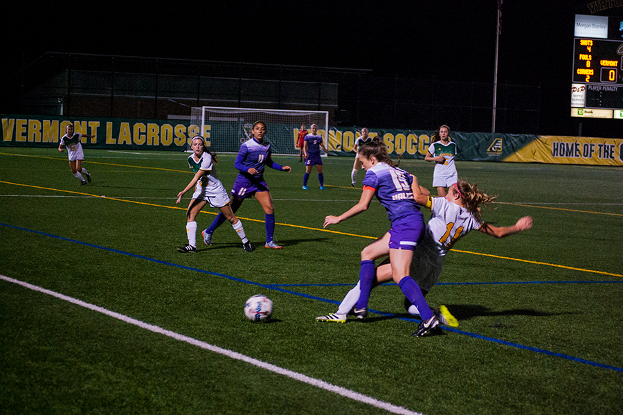 Junior Brooke Jenkins kicks the ball away from a University at Albany player Oct. 12. Jenkins scored the winning goals in the last two games of the America East championship against Albany and Binghamton University.