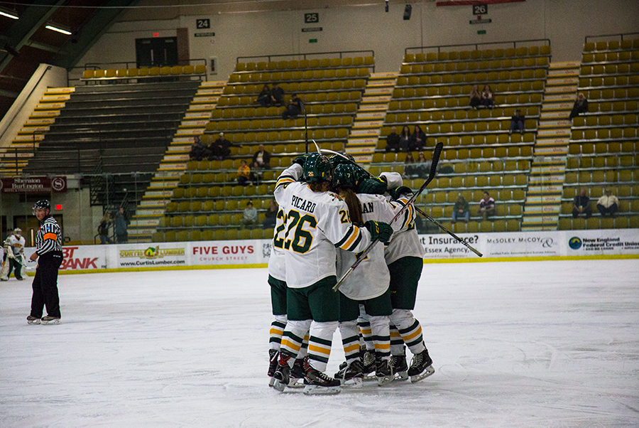 The women's hockey team celebrates a goal against the University of New Hampshire Oct. 10. The Catamounts hold a 5-12-3 record.