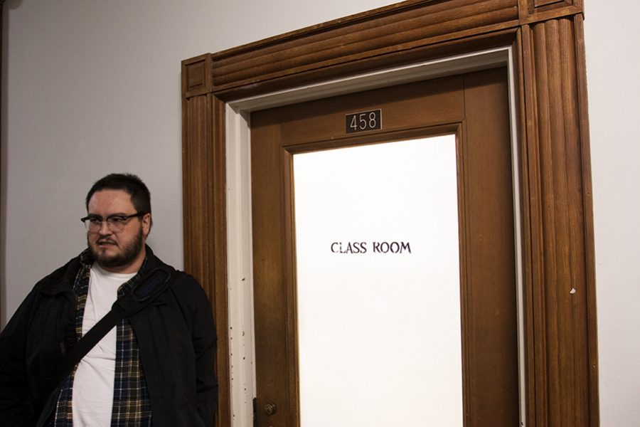 UVM lecturer Isaac Cates stands outside of his classroom Feb. 26 in the Waterman building after his class let out. Cates said he deleted photographs of his class taken by senior Oliver Pomazi because they were a violation of privacy.