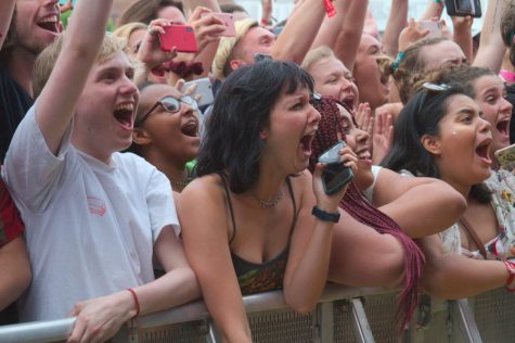 The crowd at the Delta Blue Stage at Boston Calling cheers as rap group Brockhampton takes the stage. Many in the front row had held their spot for as long as as six hours.