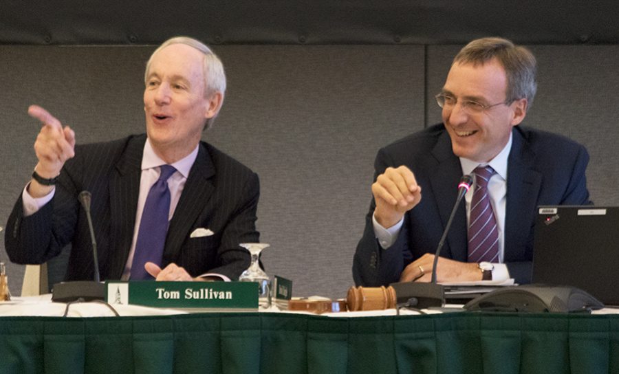 (Top) Ed Pagano 85 sits at the board of trustees meeting Oct. 26. (Bottom) President Tom Sullivan and David Daigle, board of trustees chairman, participate in the board of trustees meeting Oct. 25. 