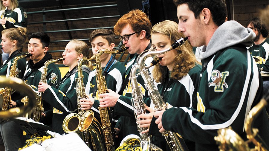 The saxophone section of the Catamount Pep Band play at the Women’s Ice Hockey game against the University of Connecticut Oct. 6. The Catamount Pep Band, consisting of 40-50 students, is the official band of the UVM athletic teams.
