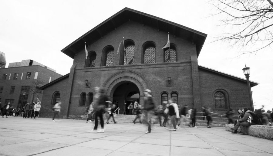 Students rush past Royall Tyler Theatre on their way to class. UVM has recently fallen behind other school in relation to its retention rate, which is 86.6 percent, between a class's first and second fall semesters. 