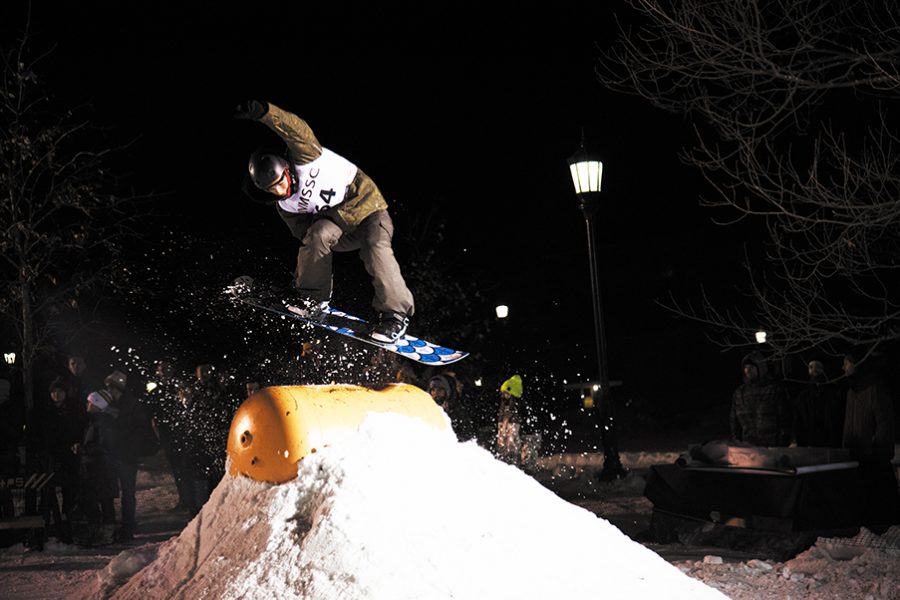 A snowboarder competing in this year’s Winter Rail Jam Jan. 25 outside the Davis Center performs a stalefish grab, hopping over the barrel. The event attracted hundreds of UVM students and was hosted by the UVM Ski and Snowboard Club in conjunction with Jay Peak Parks and UVM Program Board. 