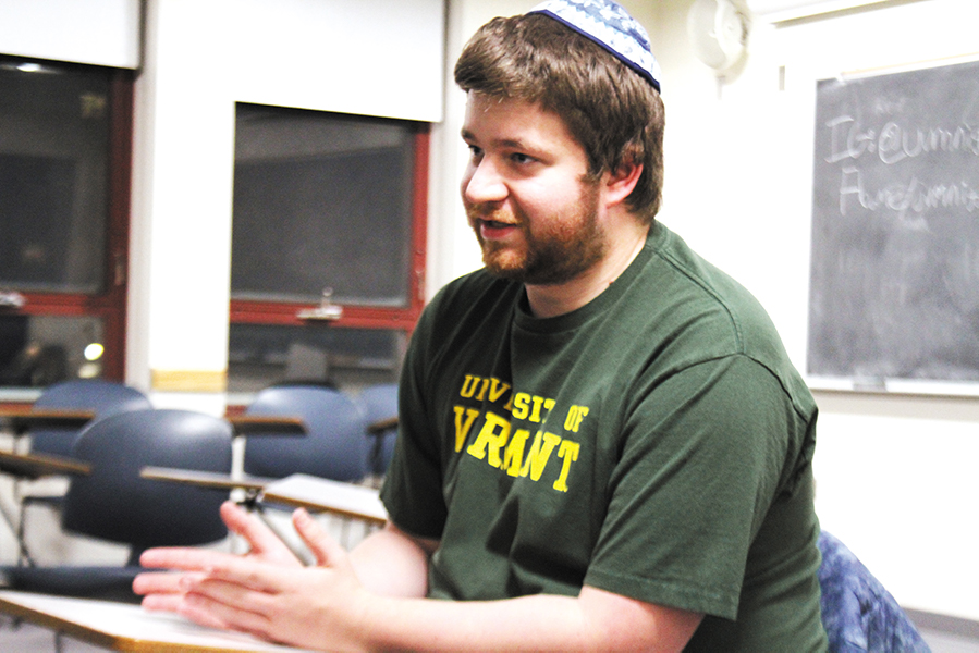 Junior Tyler Lederer sings at The Niggun Collective Club meeting Jan. 30. The club is a gathering of students who practice niggun singing, a melody that originated in Jewish religion, a wordless tune that uses musical sounds such as “lai-lai-lai” and “ya da dai.”