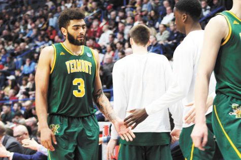 Anthony Lamb makes his way to the bench as Florida State makes a UVM win seem unreachable in the final minutes of the game March 21.