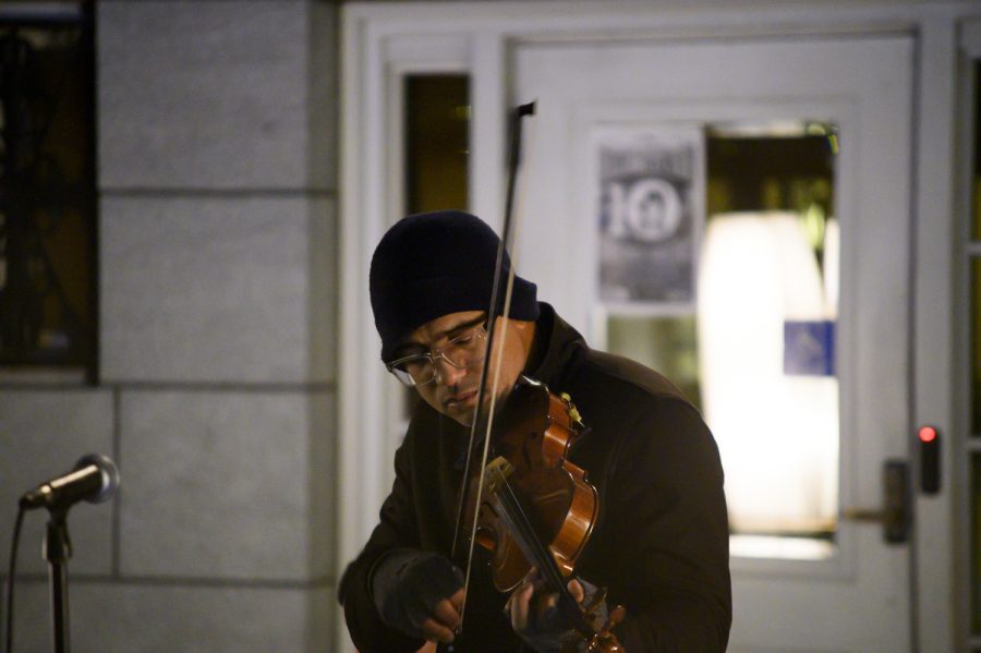 The artist known as DBR performs at 1 a.m. Oct. 27 in front of Burlington City Hall. His performance was part of a 24-hour demonstration meant to call attention to U.S. immigration policy.