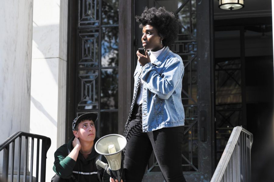 Senior Harmony Edosomwan speaks during a protest organized by NoNames for Justice and Queer Student Action at Waterman building, Sept. 25. The protest called for the release of the complete Campus Climate Survey data from the University.
