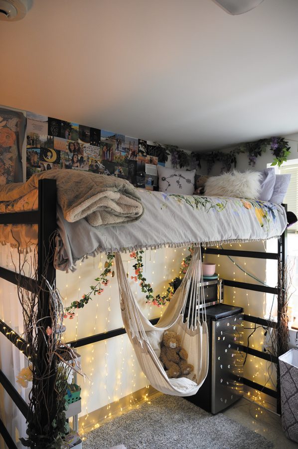 A teddy bear sits in the swing in first-year Phoebe Kaparian’s dorm room, Sept. 24. Kasparian’s inspiration behind her decorations was flowers and nature, she said.
