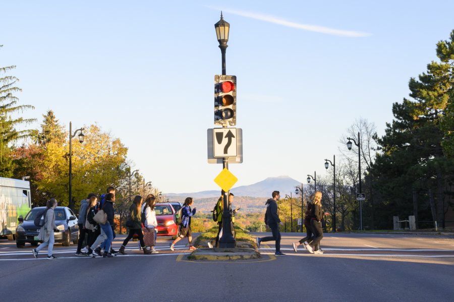 Pedestrians cross Main Street at the corner of University Heights, Oct. 19. The intersection is among the busiest in Vermont.