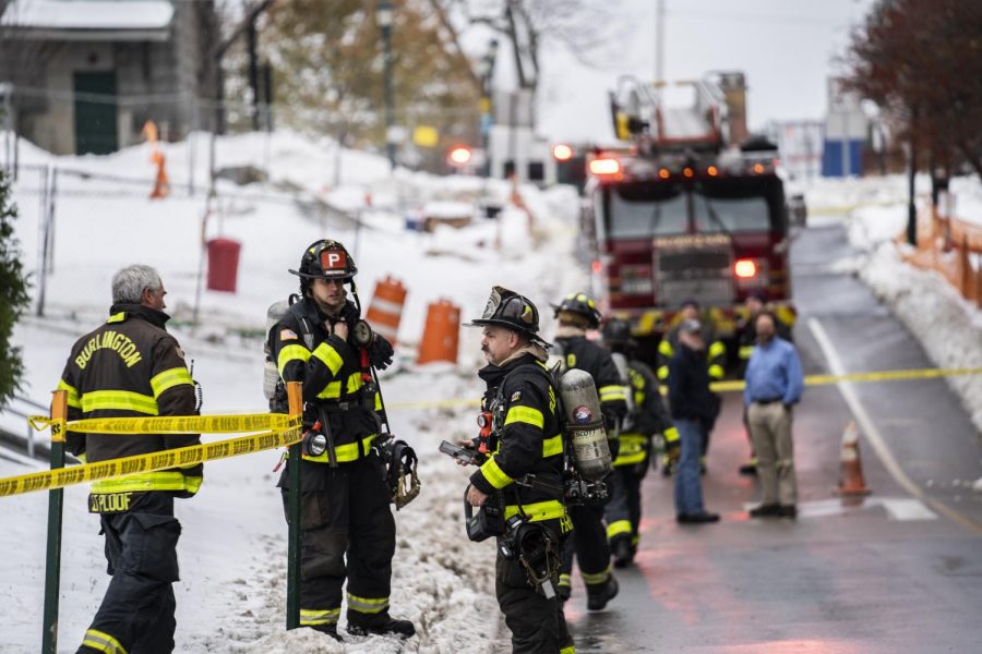 Firefighters stand outside Innovation and Discovery Halls Nov. 15. A chemical fire in a lab closed the two buildings down all day Friday. 