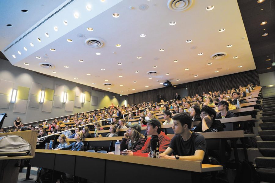 Students fill a lecture hall, maskless, prior to the COVID-19 pandemic November 2019.