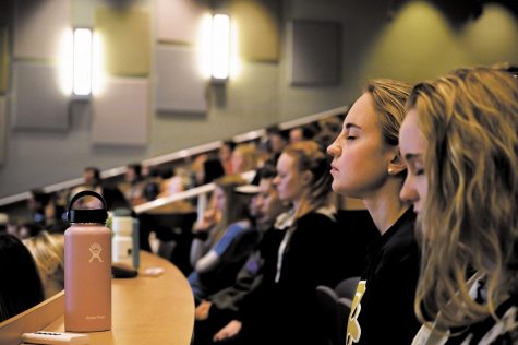 Students sit close to one another, maskless, in a lecture hall prior to the COVID-19 pandemic November 2019.