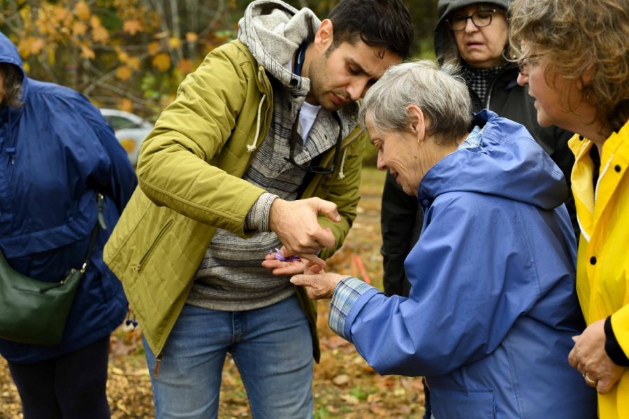 Postdoctoral associate Arash Ghalehgolabbehbahani identifies different parts of the saffron plant, Oct. 31. Judith Allard ‘67 G ‘69, who is holding the saffron, is one enrollee of UVM’s Osher Lifelong Learning Institute program.