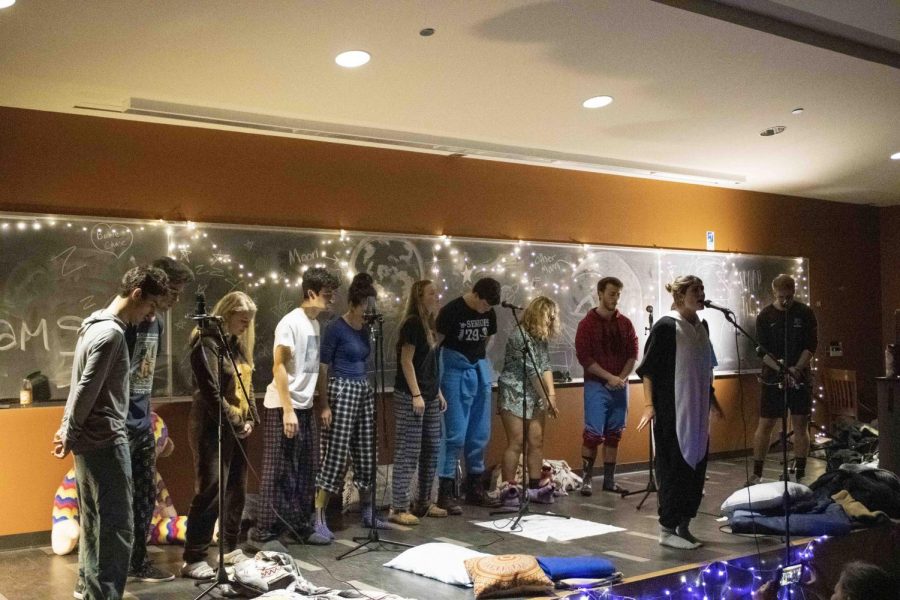  Members of the co-ed a cappella group, Hit Paws, perform in their pajamas in Fleming Museum, Nov. 15. The club is one of five a cappella groups on campus and is one of three gender-inclusive groups.