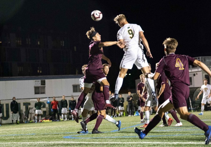 Men%E2%80%99s+soccer+forward+Rasmus+Tobinski%2C+a+first-year%2C+heads+the+ball+over+the+head+of+an+Iona+College+player+in+a+September+2019+game.