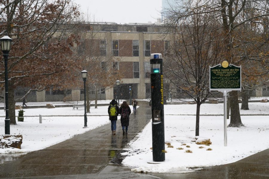 A blue light shines through the falling snow on the Andrew Harris Green, Dec. 6. UVM Emergency Management and SGA President Jillian Scannell, a senior, are currently working to evaluate the use of the lights on campuses nationwide.

