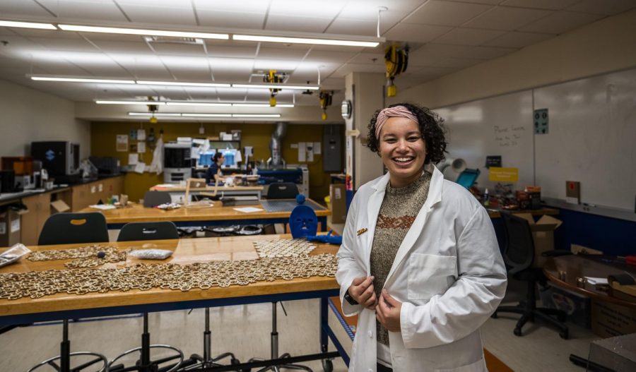 Junior Dia Brown poses in the UVM FabLab, Nov. 20. The FabLab makes rapid-prototyping tools available to UVM students and faculty.