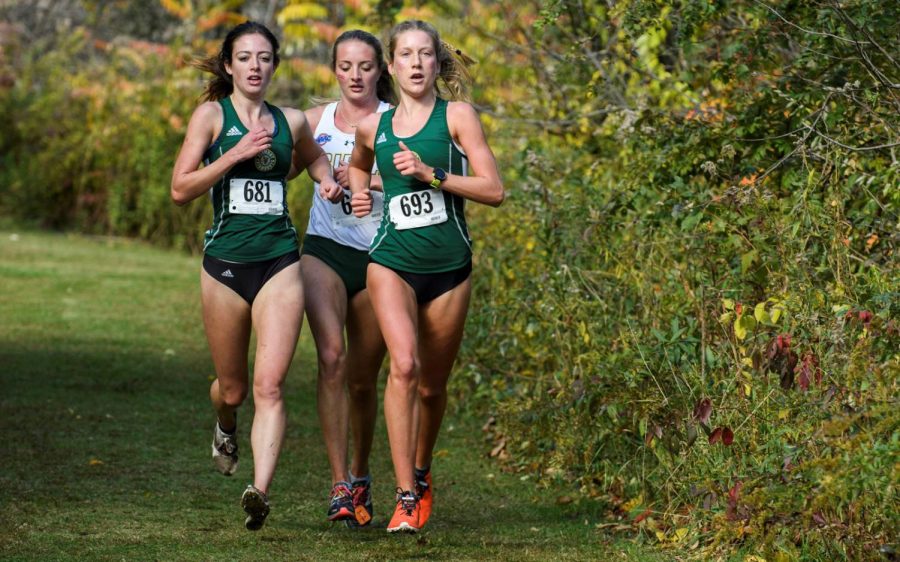 Senior Phoebe Koski (Left) runs with sophomore teammate Bel Sogoloff in the NCAA Northeast Regionals, Nov. 15. Koski posted a time of 20 minutes, 44.8 seconds, a personal best, for the 6k. 