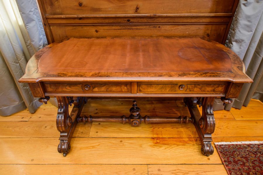 An antique wooden desk first belonging to  Vermont Senator Justin Morrill, author of the Morrill Act of 1862 establishing the country’s first land grant universities, sits in President Garimellas office. 