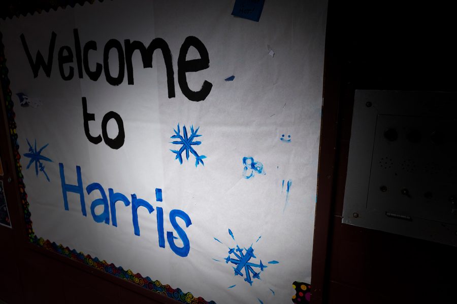 A sign welcoming students to Harris Hall, seen Feb. 13. On the right hand side of the sign a painting of a penis can be seen. 