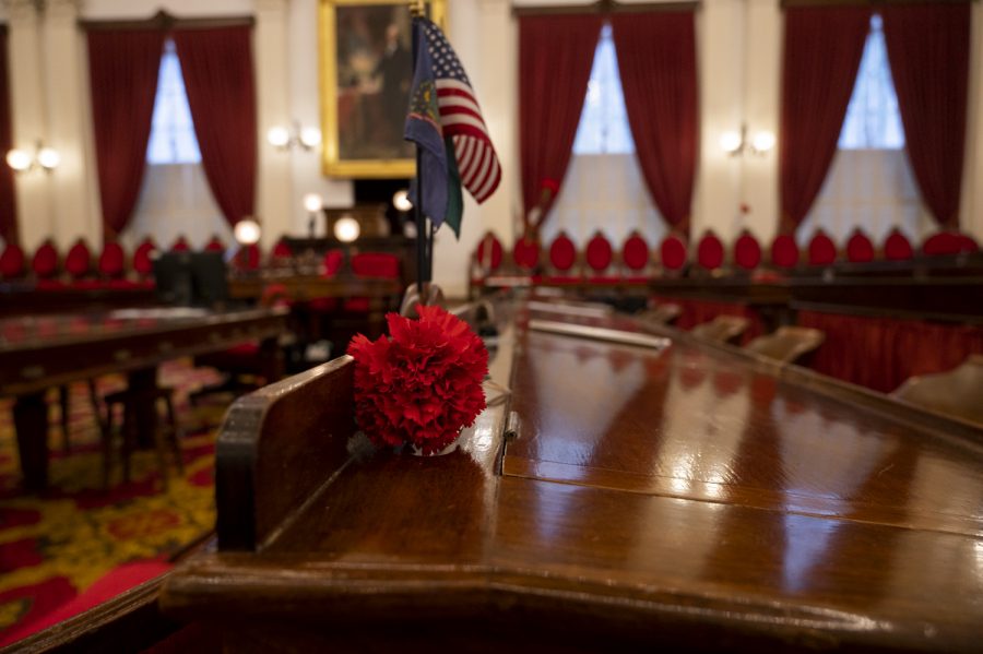 A red carnation lays on the desk in the Statehouse chambers, Feb. 13. Carnations are most often representative of love and affection.
