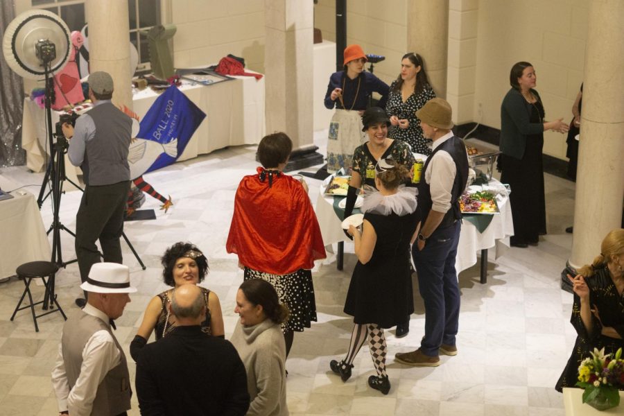 Attendees of the Costume Art Ball stand in their costumes for the opening of new exhibits, Feb. 20. Food, drinks and live music were offered at the event.