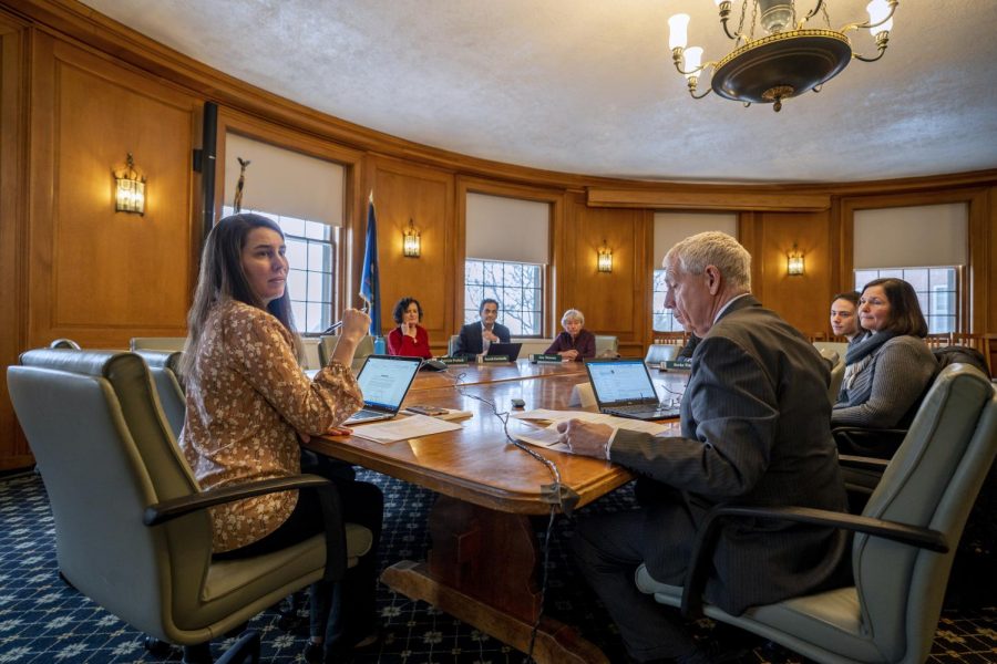 Members of the board of trustees prepare for the March 2 meeting where they selected Ron Lumbra to be the new chair and established the new sustainability work group.