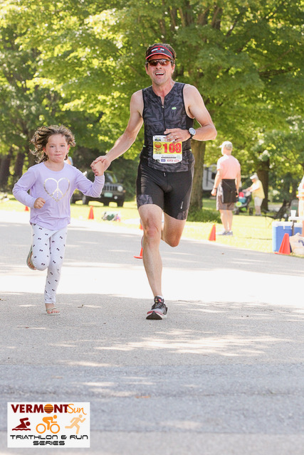 Stapleton and his daughter run during an Olympic Triathlon at Lake Dunmore in 2018.