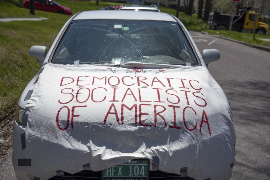 A budget cuts protestors car adorned with a Democratic Socialists flag May 14, 2020. 
