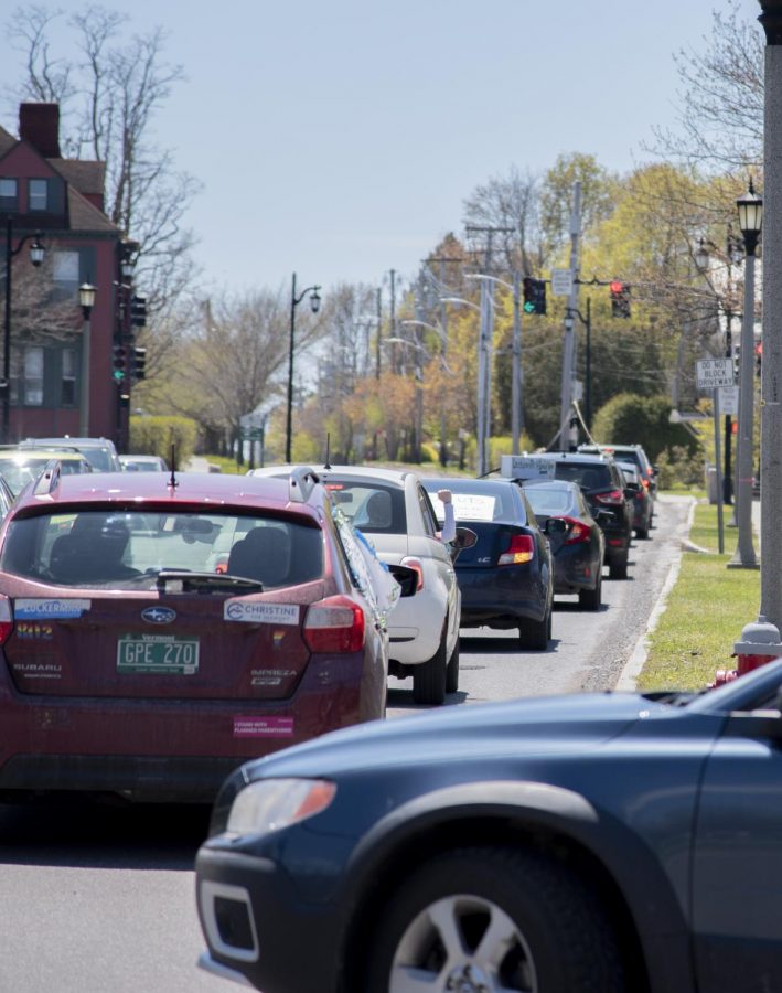 Cars full of protestors line South Prospect Street in Burlington, May 14, 2020. Despite a COVID-19 stay at home order, members of the UVM community protested potential UVM budget cuts in their cars. 
