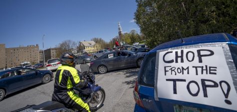 Protestors gather in the Waterman Parking lot May 14. Waterman is home to the offices of UVM executives including President Suresh Garimella.