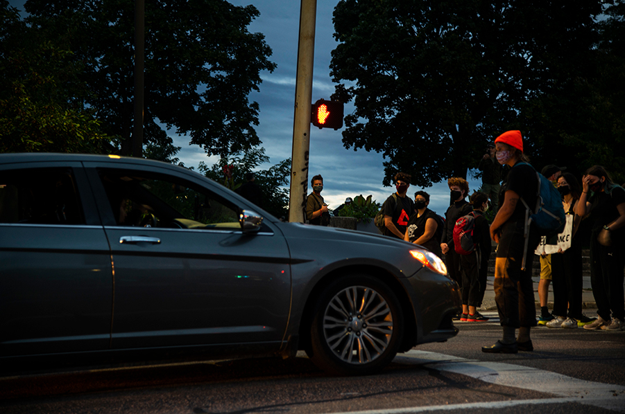 Several protesters blocked traffic on Battery Street to let protesters cross the road. One car pulled into the wrong lane of traffic to sit in front of them Sep. 1. “This is my third day here and I have been trying to be as involved as possible because I know there’s an incredibly long history of racism in Vermont,” said Junior Zoe Kennedy. “And it’s not the job of people of color to fix that, it’s people with privilege like I have.” 