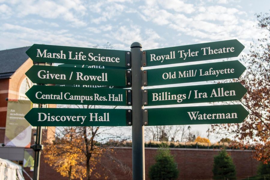 Street signs outside the Davis Center point students and visitors towards different campus buildings outside the Davis Center.