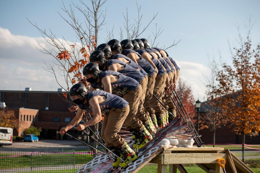 A skier from the UVM Ski and Snowboard Club launches from the top of the pitch, setting up to hit the rails below Oct. 23.


