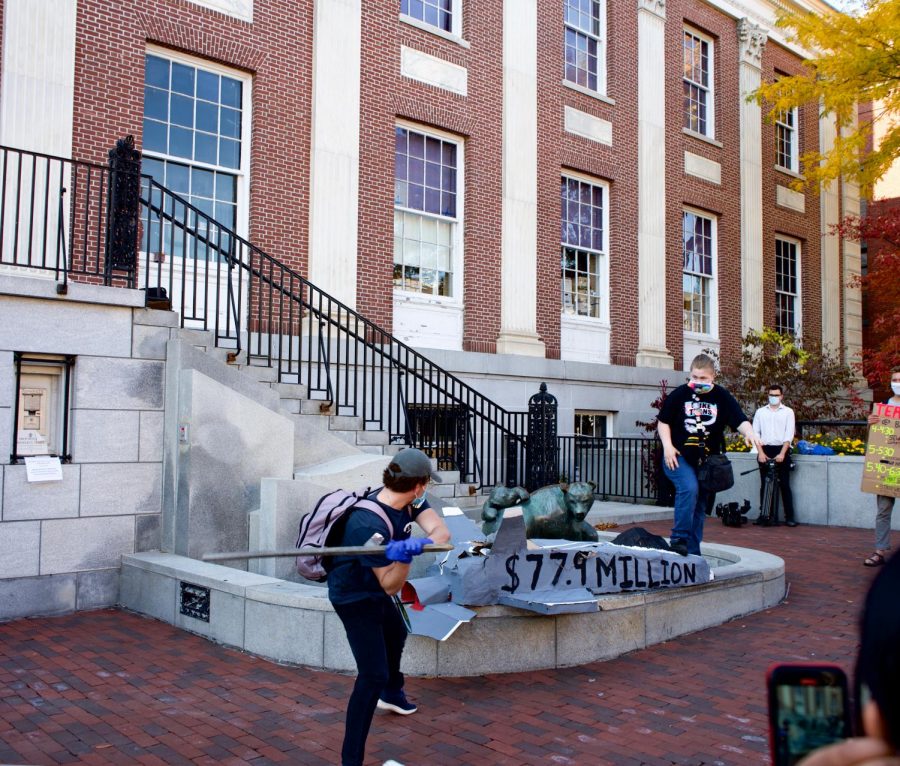 Climate strike participants smash a replica of an F-35 in front of City Hall, Oct. 23.