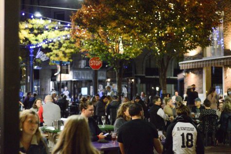 A group of restaurant goers sit outside of Sweetwaters on Church Street, Oct 23.