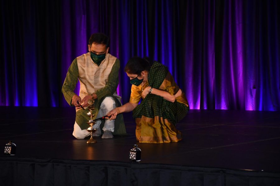 Suresh Garimella (left) and his wife Lakshmi light the ceremonial lamp that signifies the start of Diwali Nov. 14.
