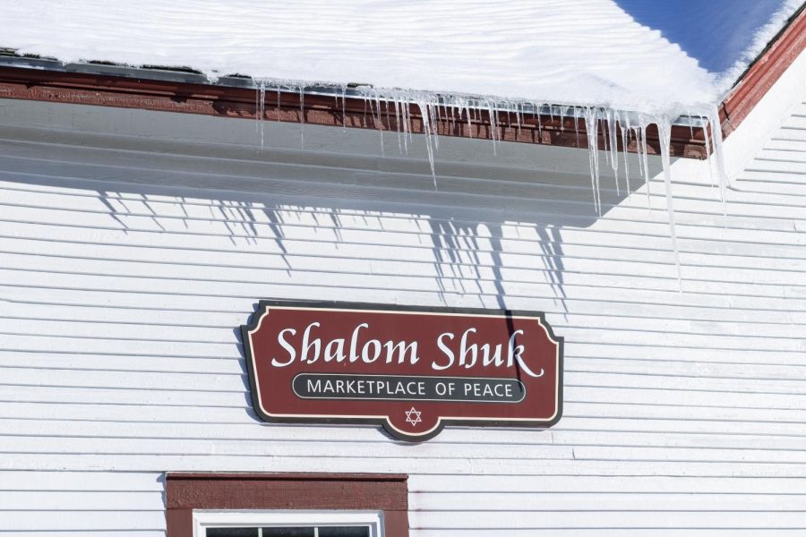 A sign outside of Shalom Shuck welcomes visitors as a marketplace of peace Feb. 4. Shalom Shuk states it is dedicated to serving the local community and dedicated to helping new Americans and the underprivileged.