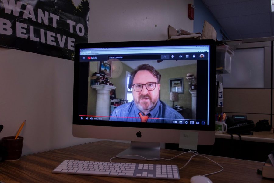 A computer displays Professor Aaron Kindsvatters first Youtube video “Racism and the Secular Religion at the University of Vermont.”
