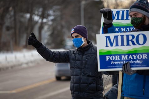 The now four-term Burlington Mayor Miro Weinberger stands on North Ave during a “honk and wave” with his supporters Feb. 19. As cars passed by they honked in support. 