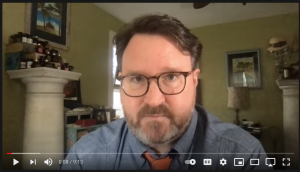 UVM Professor Aaron Kindsvatter records himself inside his home for his first video titled “Racism and the Secular Religion at the University of Vermont.”