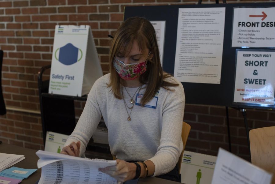 UVM Senior Kayla Downs works at the check-in table for the Ward 8 polling station March 2. 