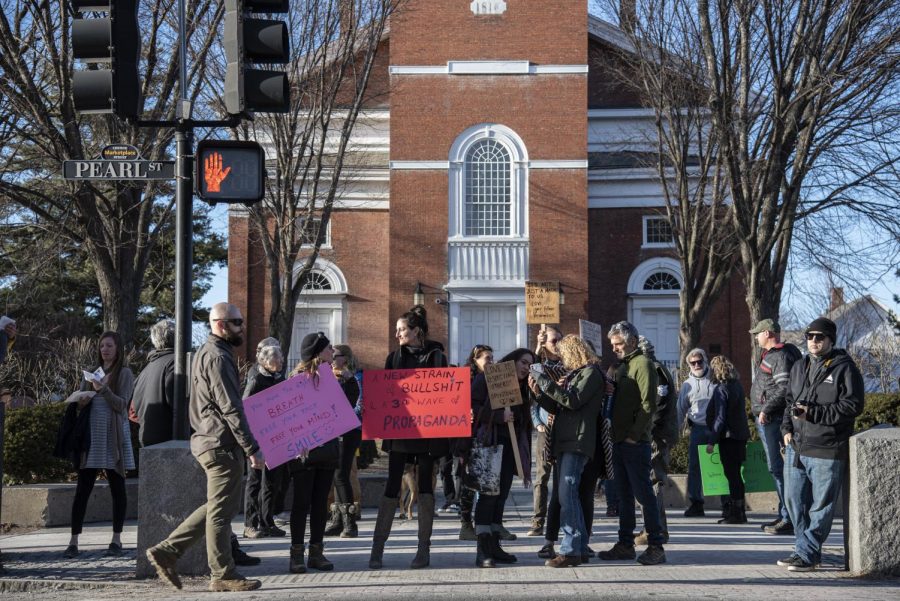  Members of Vermonters Against Unconstitutional Lockdowns and Tyranny, also known as VAULT, gather on Church street for an anti-mask flash mob that began at 5:30 p.m. March 20. The flashmob met at 1 Church street and proceeded to walk down towards City Hall.