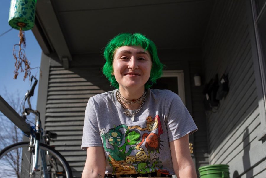 Senior Brooke Katz sits on the porch of their apartment on Colchester street March 3.