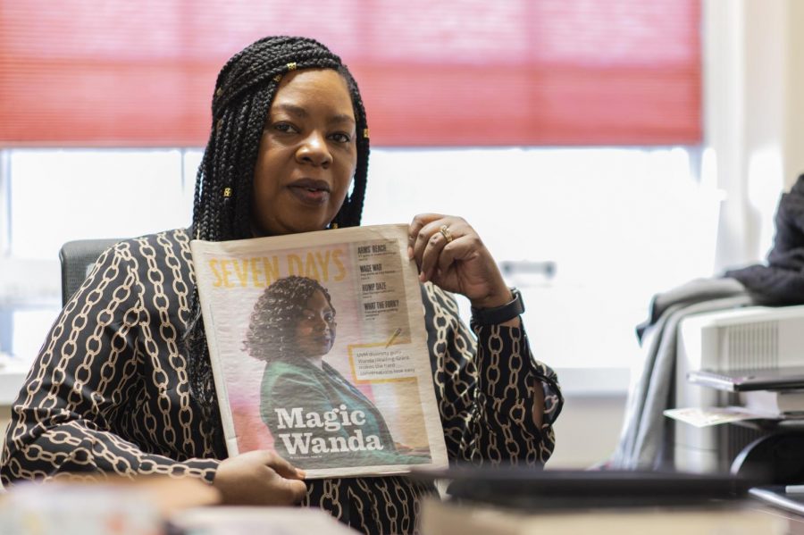 Wanda Heading-Grant, vice president for diversity, equity and inclusion, sits in her office in the Waterman building holding up a story written about her by Seven Days. Grant says she is extremely proud of this story.